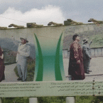 musevin and gaddafi on billboard